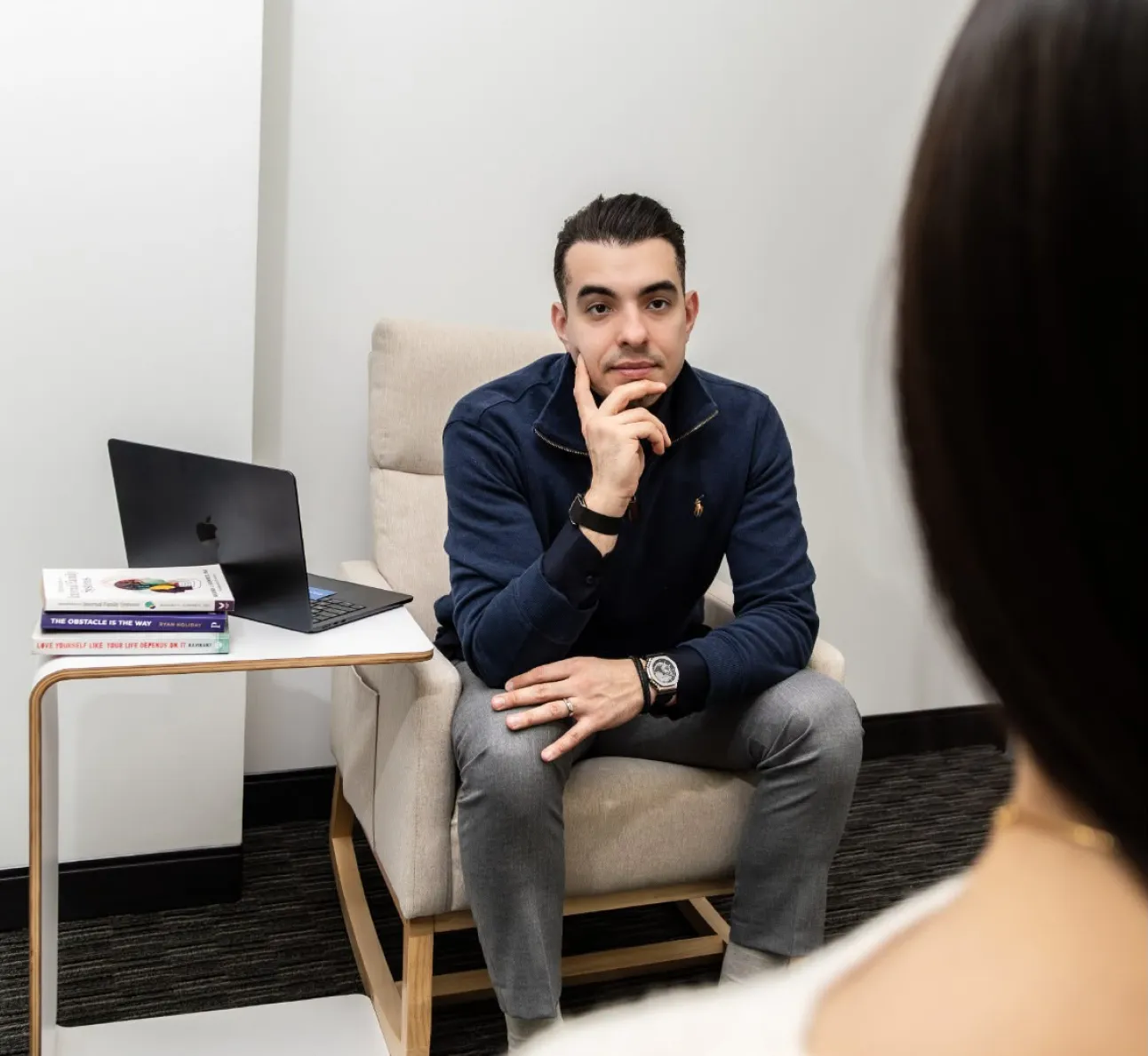 A clinician talking to a client face to face