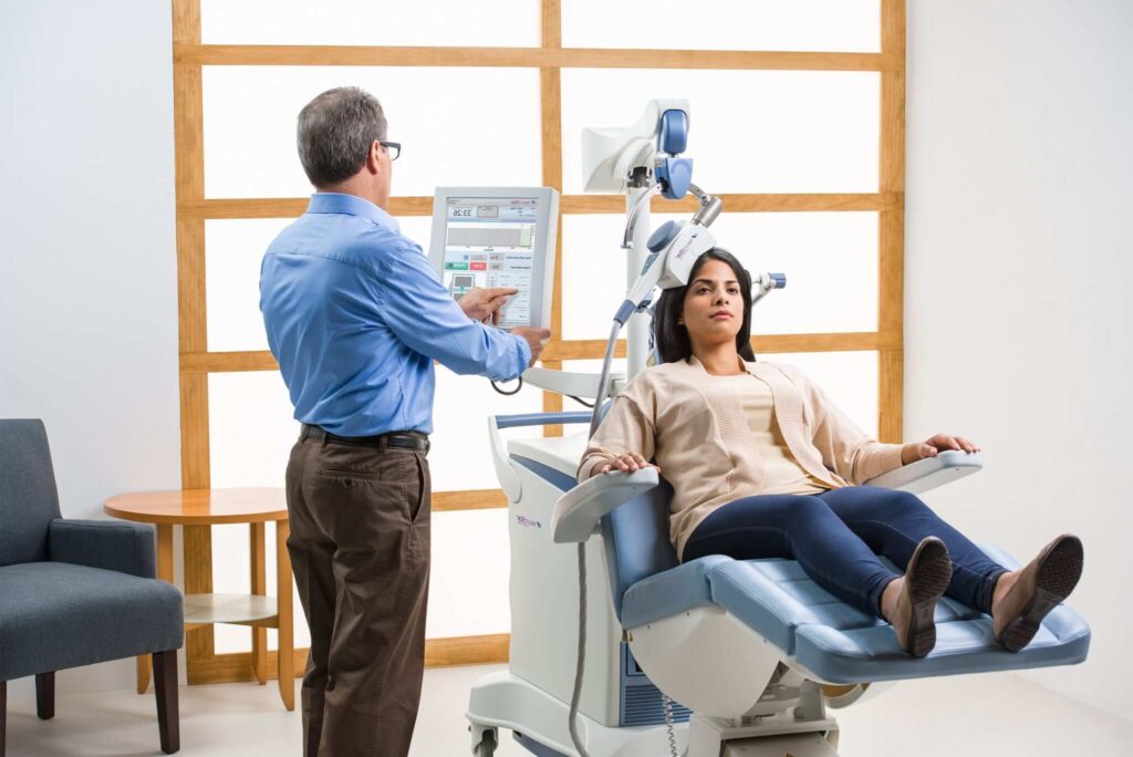 TMS device being used for a patient