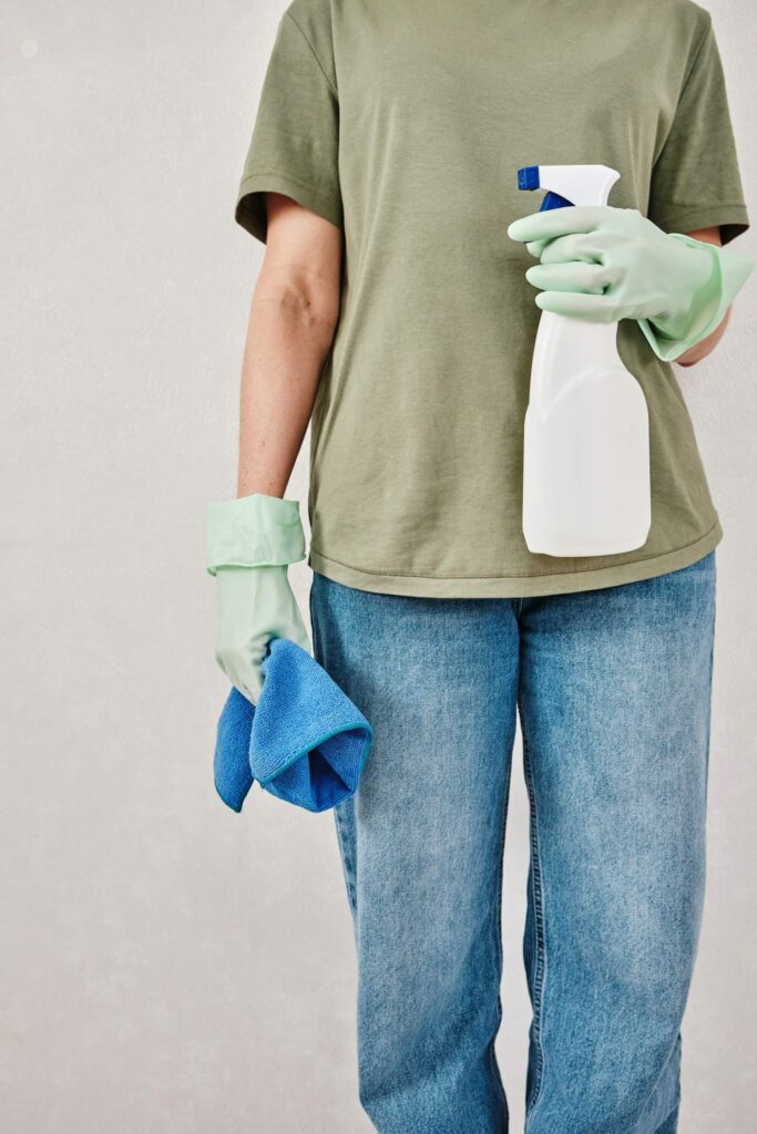 a woman with cleaning stuff